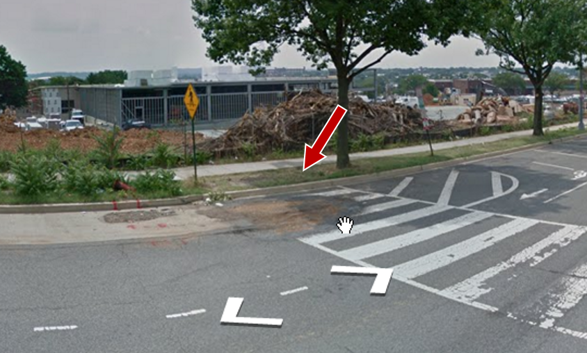 An older Street View image without a curb ramp at the end of crosswalk