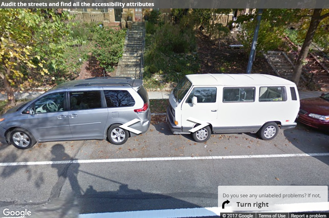 A Street View image of two cars blocking the view of the sidewalk