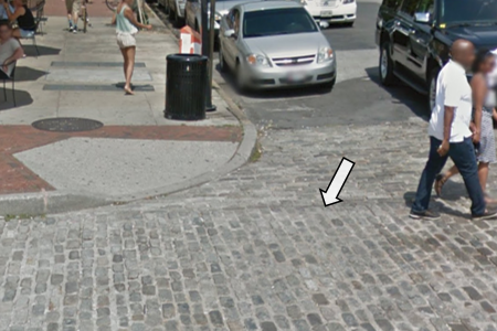 A Street View image of a cobblestone road