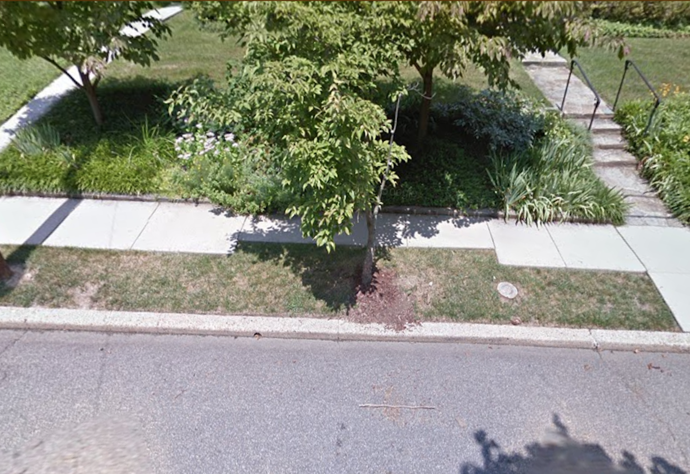 A Street View image of a narrow sidewalk less than 3ft wide